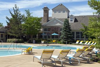 Two resort-style pools with lounge seating